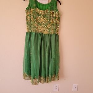 A Jarjit dress made from saris green colors with silk lining sleeves less.